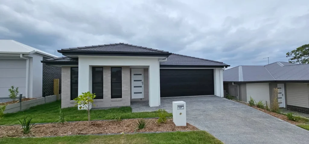 Single-storey home with a fresh white exterior paint finish